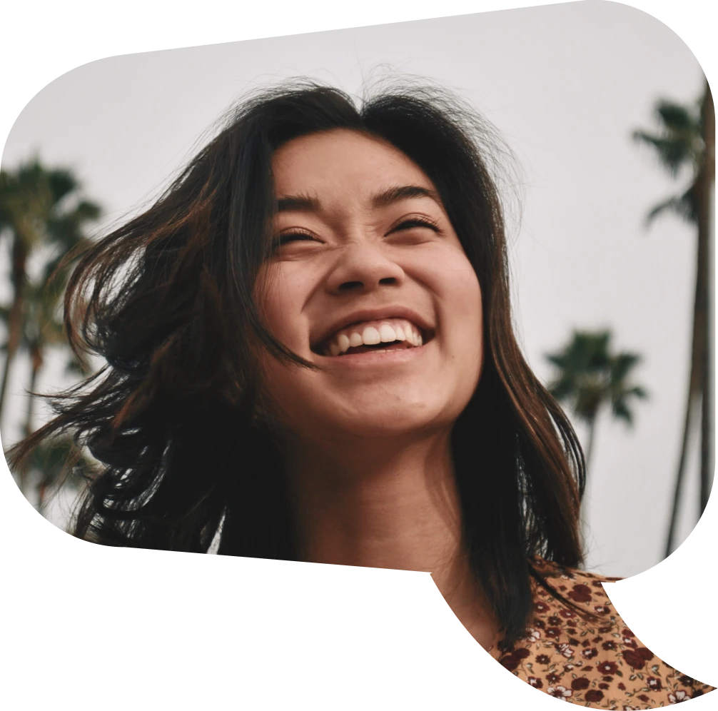 Picture of a woman in speech bubble smiling